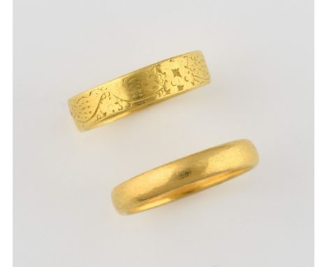 Two gold rings, vintage patterned band, hallmarked London 1969, ring size L, and a plain wedding band, size K 1/2, both in 22