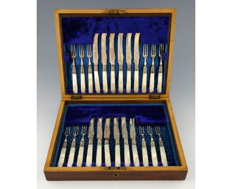 Set of twelve Victorian silver and mother of pearl handled fruit knives and forks with engraved decoration, by R F Mosley & C