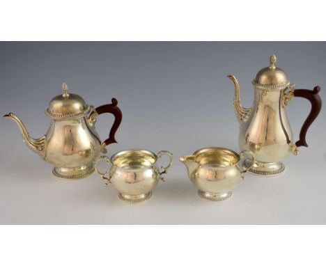 Modern silver four piece tea and coffee service, comprising tea pot, coffee pot, cream jug and sugar bowl, by Barker Ellis Si