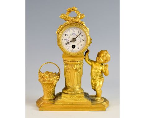 French gilt metal clock, the clock supported on a pillar flanked by a cherub and a basket of flowers, 20cm high.     Case, gi