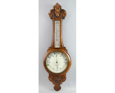 Early 20th Century oak barometer with thermometer and weather dial by Benetfink & Co London 86 cm .     