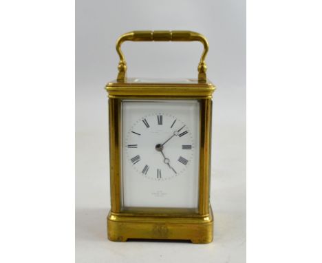 French brass carriage clock the eight day movement striking the hours and half hours on a bell. 18.5cm 17cm.     