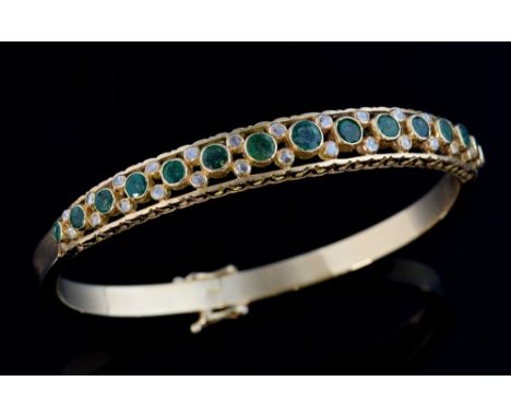 Emerald and diamond set hinged bangle,  round emeralds and rose cut diamonds in an openwork setting, 9ct gold, import marks f