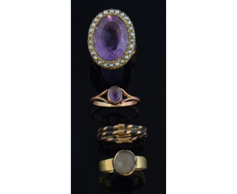 Amethyst and pearl ring set in unmarked yellow metal, an elephant hair ring and two other gem set rings, 9 ct unmarked  .    