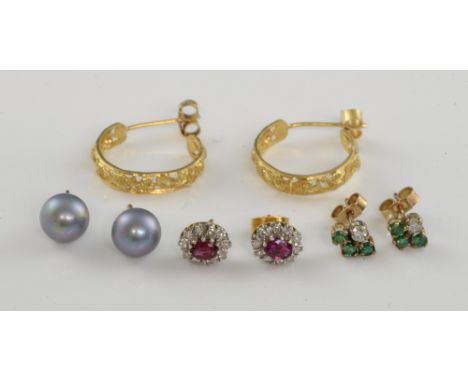 Four pairs of earrings, ruby and diamond cluster, and gold hoops both 18 ct, small emerald and diamond studs and grey pearls,