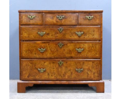 18th century style walnut and herring bone cross banded chest of three short drawers above three long drawers on bracket base