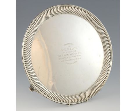 Victorian silver salver with deep gadrooned border and presentation inscription, on three shaped feet, by Martin, Hall & Co.,
