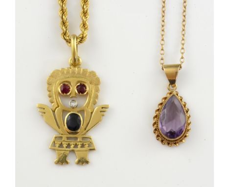 South American figure pendant set with sapphire diamond and ruby in 18 ct gold, on 9 ct gold chain,and an amethyst set .     
