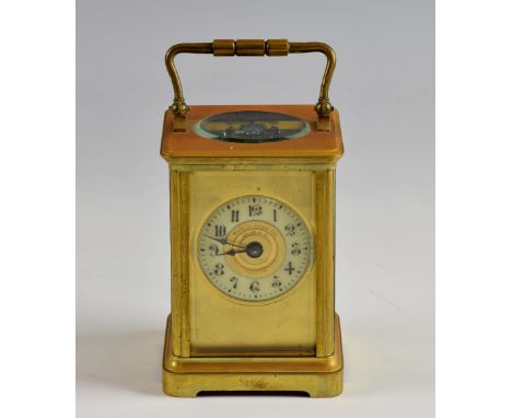 French brass carriage clock the eight day movement striking the hours and half hours on a gong, retailed by Jacot & Co Capeto
