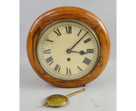 Early 20th Century oak single fusee wall clock, diameter 30cm .     