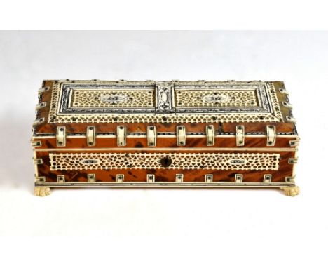 Early 20th century Indian tortoiseshell, ivory and bone mounted sandalwood box, on four lion's paw feet, 26cm wide,PLEASE NOT