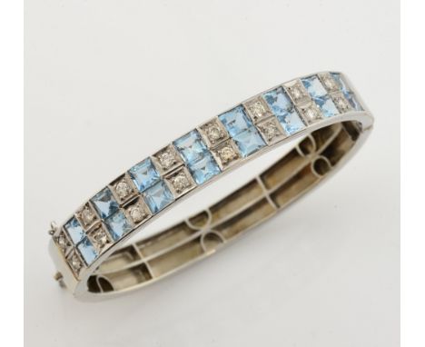 Aquamarine and diamond oval bangle, sixteen square cut aquamarines, estimated total weight 4.65 carats, set with sixteen roun