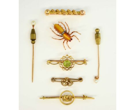 Six Victorian and later gold brooches, a double heart seed pearl set brooch, another with peridot, a spider brooch set with t