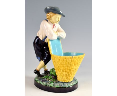 Minton majolica figure modelled as a boy leaning on a grape basket, model no. 421, impressed marks to underside, 25cm.     Ch
