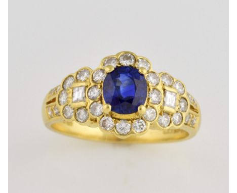 Sapphire and diamond dress ring, oval cut sapphire, estimated weight 0.96ct, surrounded by round brilliant cut diamonds and r