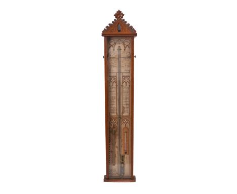A late 19th Century Admiral Fitzroy Barometer, having the paper scales and brass indicators to the sides, within an oak case,
