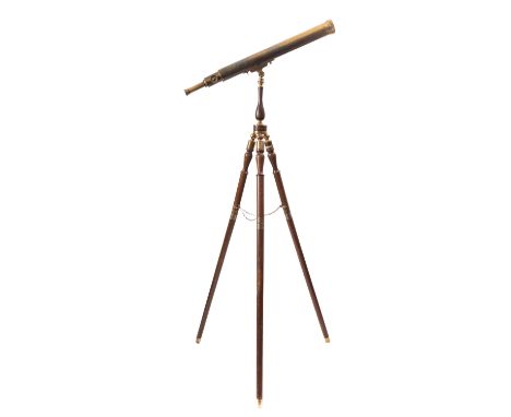 A brass refracting telescope by Brights of Nettlebed. The 24 inch main tube with rack and pinion focus on tripod base
