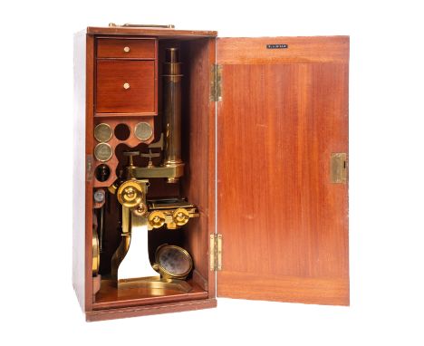 An early 20th century lacquered brass monocular microscope, maker Baker, London, singed as per title to base with  address fo