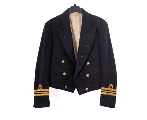 An Elizabeth II Royal Naval Lieutenant Commander's uniform and dress sword, the sword with straight single edge bade, acid et