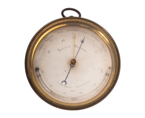 An early 20th century lacquered brass circular aneroid barometer unsigned with silvered vernier dial numbered '14857' above t