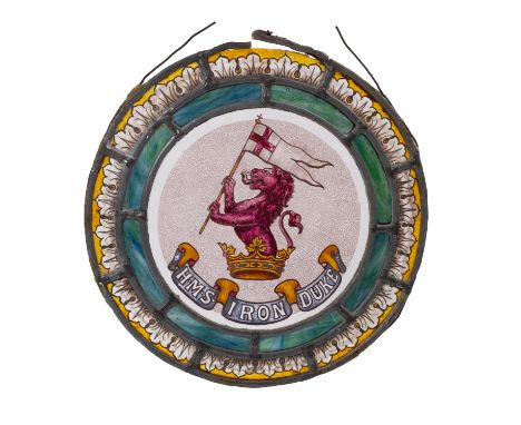 An early 20th Century circular stained glass panel HMS 'Iron Duke'.  Central armorial with lettering below and 'broken' green