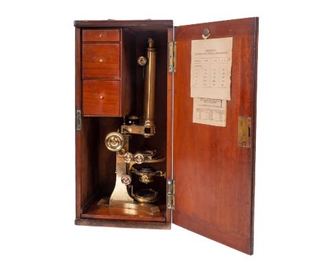 A Victorian brass compound binocular microscope, maker C Collins, London, the  binocular tubes with rack and pinion focus wit