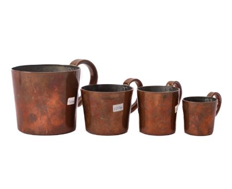 A set of early 20th Century copper Rum mugs, comprising half Gill, Gill, 1 and half Gill and pint measures. 