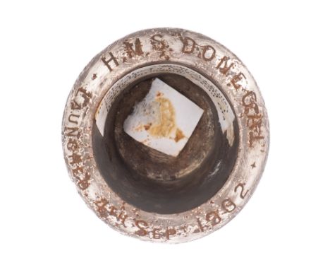 A commemorative steel rivet head inkwell for the Royal Navy Monmouth-class armoured cruiser HMS 'Donegal', inscribed with lau