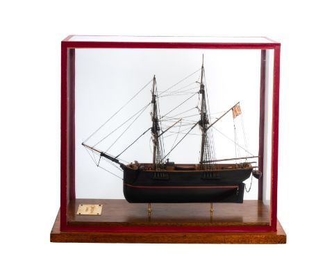 An early 20th Century cased scale model of ' Whitby Collier'. Standing rigged above a wooden deck and fittings over a plank a