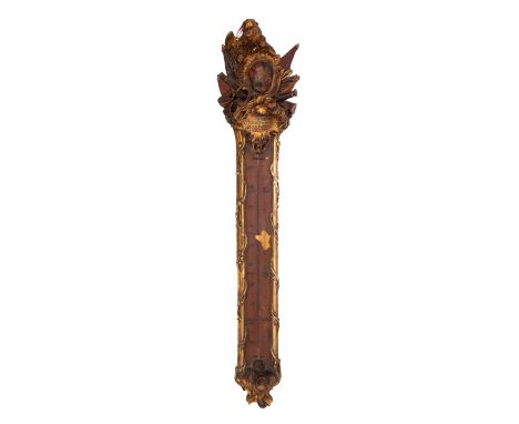An 18th century continental giltwood thermometer decorated with carved griffin above painted coat of arms over militaria, ins