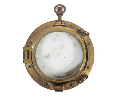 A 20th Century bronze porthole. Having a central glazed panel with a circular border and handles, maker's stamp to the door f