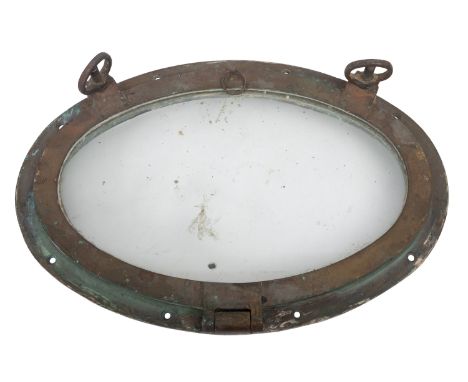 A 20th Century brass oval porthole. Having a glazed panel to the centre and two bolts on the left side, 49cm high, 33cm wide.