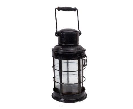A late 19th century  ship's lantern, turned wooden swing handle over chimney and  hexagonal glazed body with original candle 