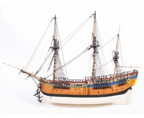 A scale model of the Royal Navy ship HMS 'Endeavour'. Shown rigged above a simulated plank deck and plank and pinned hull, fi