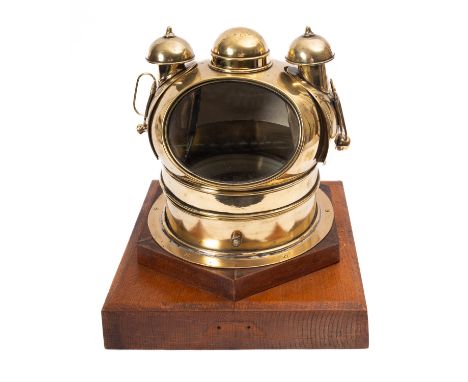 A Victorian brass mounted binnacle, having a 7' dry card compass within a brass cover with lamp boxes to the sides, mounted o
