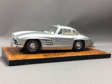 THREE DIE-CAST SCALE MODELS,Crestley Collection Mercedes 'Gull Wing' 300 SL with stand, Danbury Mint 1936 Packard Twelve Spor