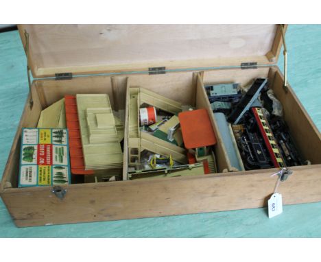 A wooden box containing vintage Hornby Duchess of Montrose engine with carriages, 00 gauge accessories including platform and
