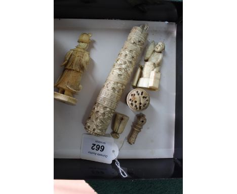 Two antique carved ivory figures, man in robes 3 1/2" high, Chinese figure with baskets, a long carved ivory holder with stic