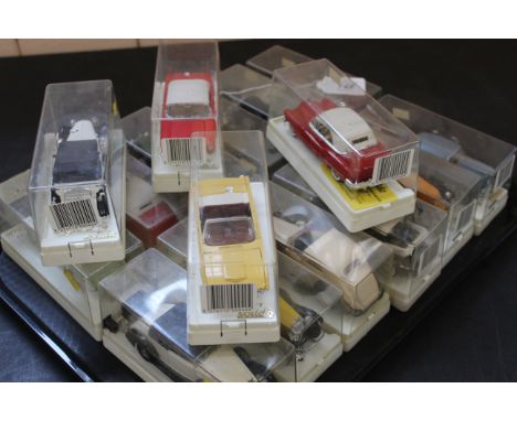 A tray with sixteen Solido cased cars