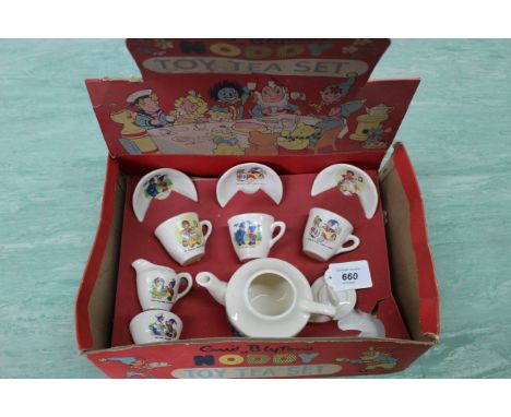 A vintage Enid Blyton's Noddy tea set circa 1960's, teapot, jug, sugar plus three cups and saucers, original box, (chips to l