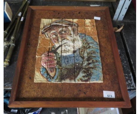 A CERAMIC TILE PORTRAIT OF A FISHERMAN