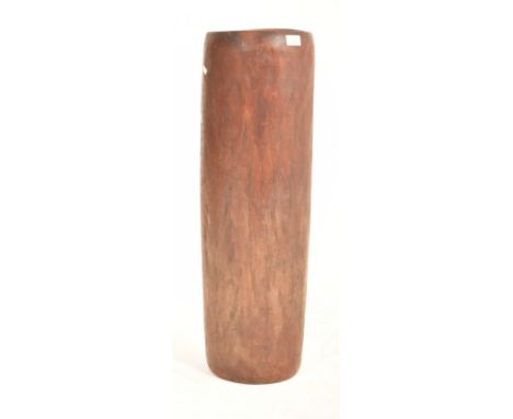 A tall tribal inspired 20th century hand carved hardwood umbrella stand planter. The stand of cylindrical form. Measures appr
