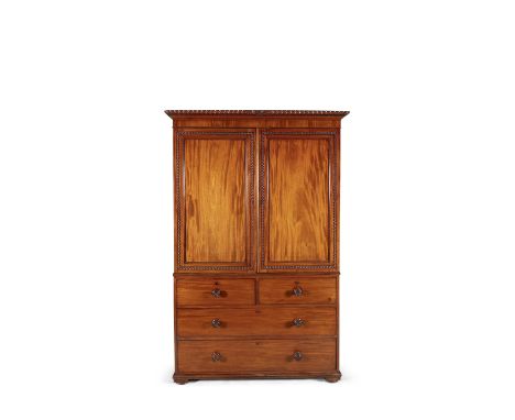 A GEORGE IV MAHOGANY LINEN PRESS, of rectangular shape, the outset cornice with gadroon edge above twin fielded panel doors, 