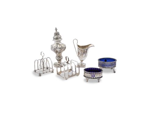 A COLLECTION OF SILVER COMPRISING; two small Victorian toast racks; two oval salts; a helmet shaped cream jug and a baluster 