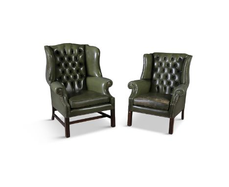 TWO MAHOGANY FRAMED LEATHER UPHOLSTERED LIBRARY ARMCHAIRS, each with button back seats and close nail leather upholstery, rai