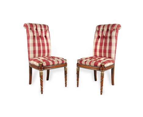 A PAIR OF BUTTON BACK UPHOLSTERED SIDE CHAIRS, covered in red and beige tartan, with scroll backs and padded seats on taperin