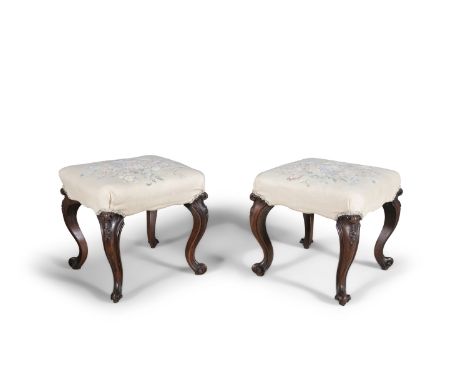 A PAIR OF VICTORIAN ROSEWOOD FRAMED SQUARE STOOLS, the seats covered in tapestry cloth and raised on carved cabriole legs and