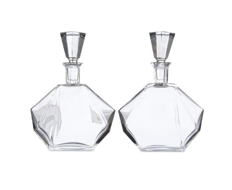 A PAIR OF ART DECO CLEAR GLASS DECANTERS AND STOPPERS, c.1930s; together with three moulded cranberry patterned beakers; and 