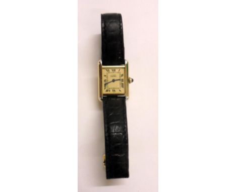 Ladies Silver Gilt Cartier Tank Shaped Quartz Wristwatch, cream dial, Roman numerals, blued hands with sapphire winder, with 