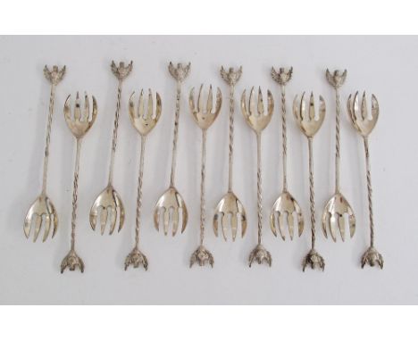 Cypriot silver sweetmeat forks with a four tine fork bowl, a barley twist handle and chased floral finial, marked 800, weight